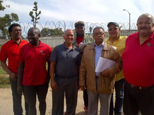 Peter Marais (leather jacket) & Joe Sellidon (yellow shirt) of the BBB with members of the EFF who came out to assist  the evicted Lefleur School residents. Photo by Renee Sellidon