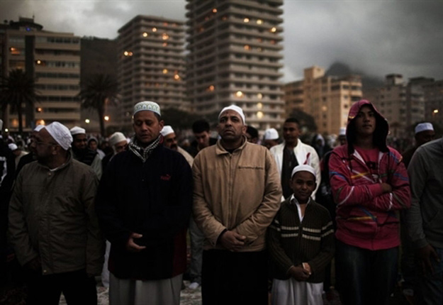 Every year thousands of Muslim men gather at Seapoin Promenade, Cape Town, for prayers and the sighting of the new moon which signals the start and will also a month later signal the end of Ramadan.