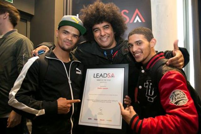 Emile YX (centre) with members of Heal The Hood showing of the Hero of The Year 2016 certificate Emile has been awarded. Photo: Heal the Hood